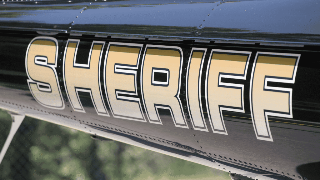 Sheriff lettering on the side of a law enforcement vehicle